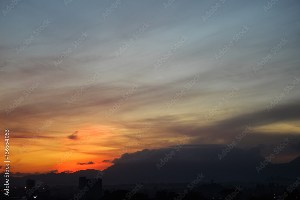 Sunset in sky beautiful colorful evening and city silhouette Sunset in sky beautiful colorful evening and city silhouette