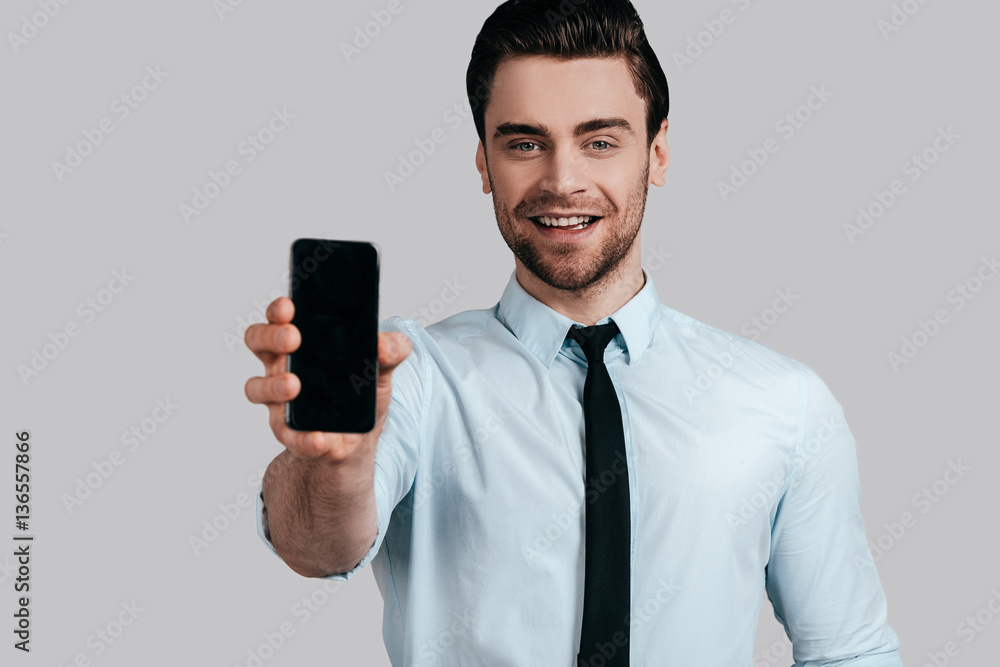 Copy space on his mobile phone. Copy space on his mobile phone.