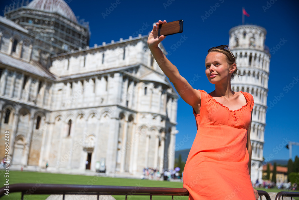 Gorgeous young woman taking a selfie with her smart phone