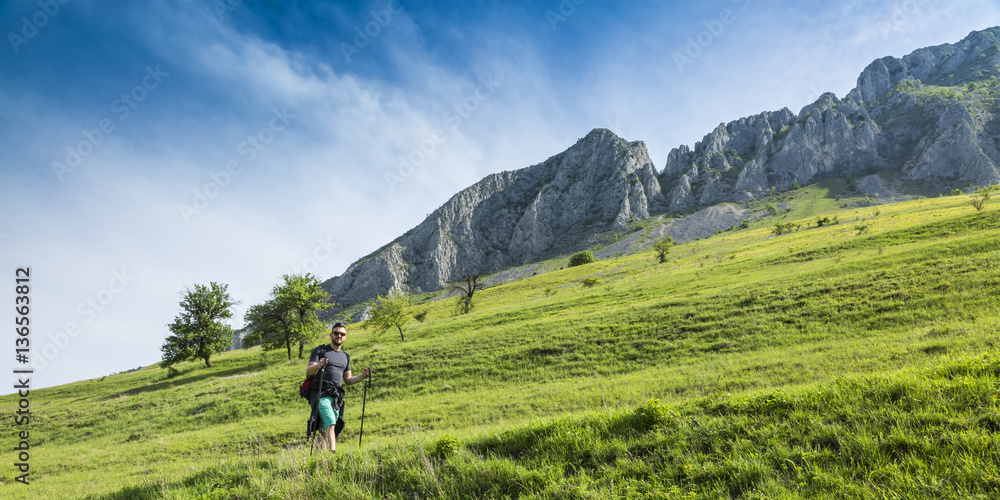 Man Hiking in Green Mountains