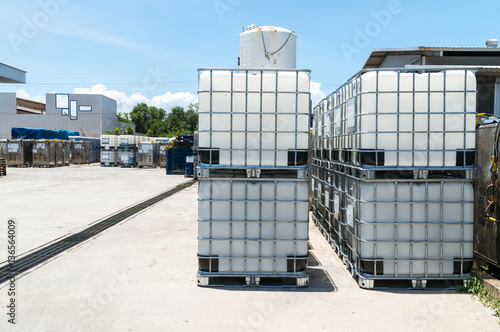 Plast IBC Tank for liquid chemical storage stored in warehouse photo