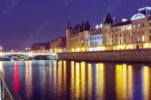 Embankment of the Seine, the Ile de la Cite and Conciergerie at night, Paris, France