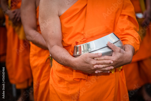 BUDDHIST MONKS : Thai Monks walking in the morning for Receive Food , Thailand.