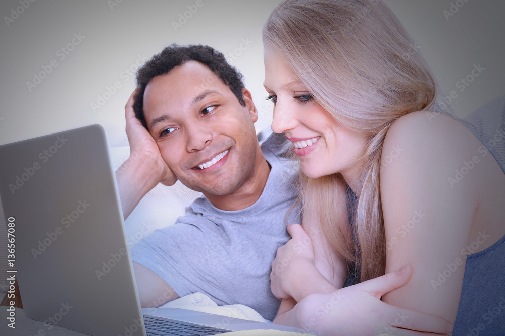 Young couple watching TV on the computer Young couple watching TV on the computer