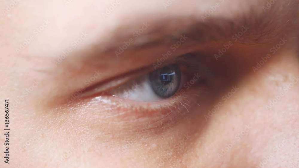 Close up of mans blue eye looking on computers monitor surfing internet. HD. 1920x1080 Close up of mans blue eye looking on computers monitor surfing internet. HD. 1920x1080