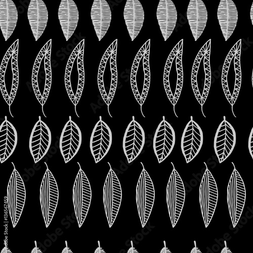 seamless pattern with fantastic leaves on a black background