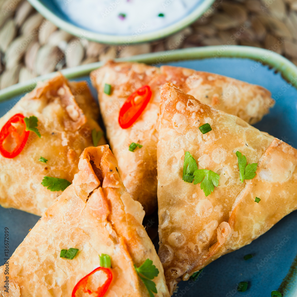 Indian Spicy Vegetable samosa with Mint Yoghurt Raita. Stock Photo