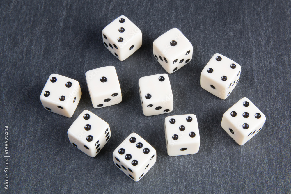 white dice on dark background white dice on dark background