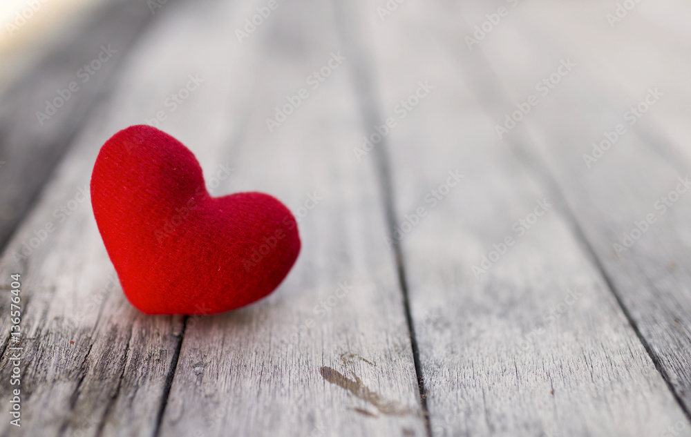 Red heart over blurred wood background, selective focus, valentine background Red heart over blurred wood background, selective focus, valentine background