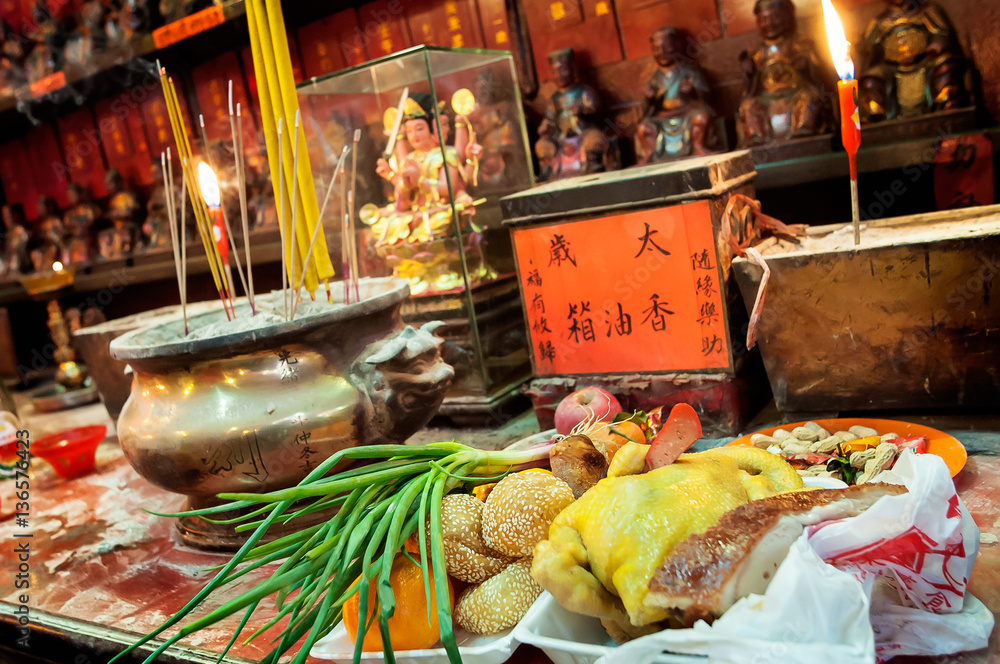 Fototapeta premium Food offerings left on the altar at Tin Hau Temple, Yau Ma Tei, Hong Kong.
