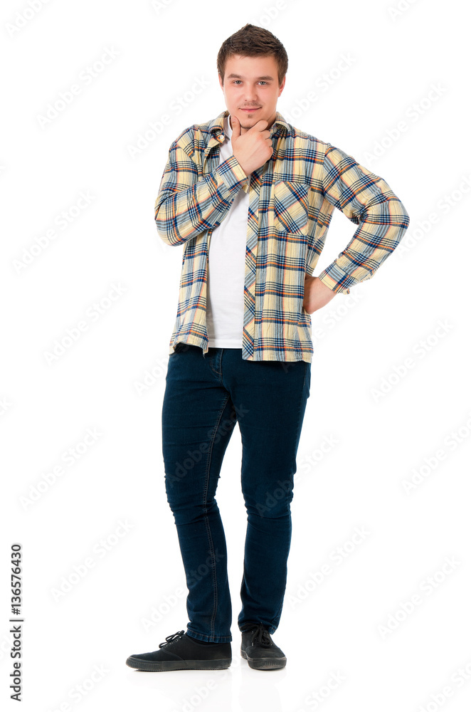 Full length portrait of young man looking at camera while holding his head, isolated on white background Full length portrait of young man looking at camera while holding his head, isolated on white background
