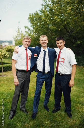 Groom with the groomsmen together in the wedding day © myronovychoksana