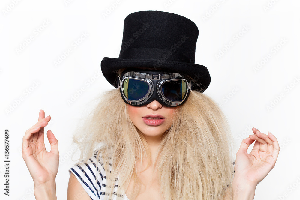 Fototapeta premium Blonde girl portrait wearing strange sunglasses and black hat