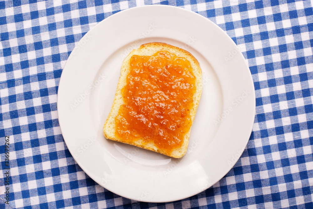 Slices of bread with orange apricot jam Slices of bread with orange apricot jam