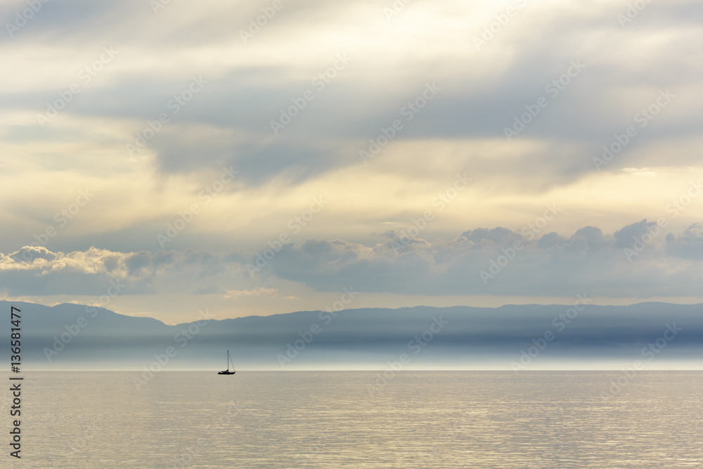 Sailboats on the lake is seen in the far distance