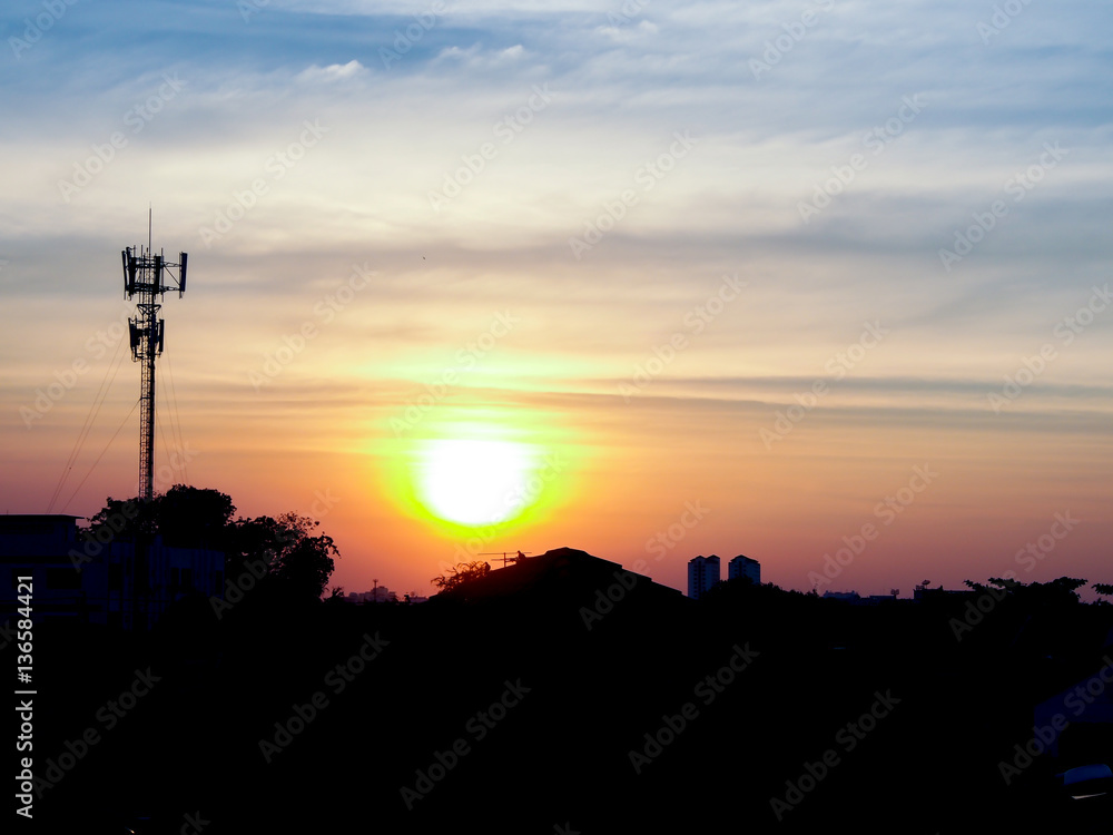 Twilight time of bangkok cityscape with radio pole silhouette
