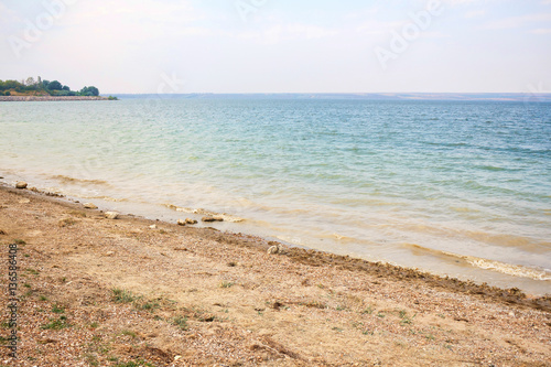 Shore and beach of costesti big blue lake  north of republic of Moldova