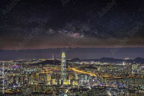 Skyline, Seoul capital in misty night and galaxy.