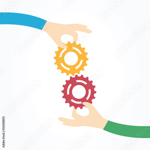 Two hands holding gears together. Teamwork, partnership, business, cooperation and management concept.