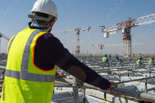 Foto Civil engineer during a site visit checking skylight roof activities