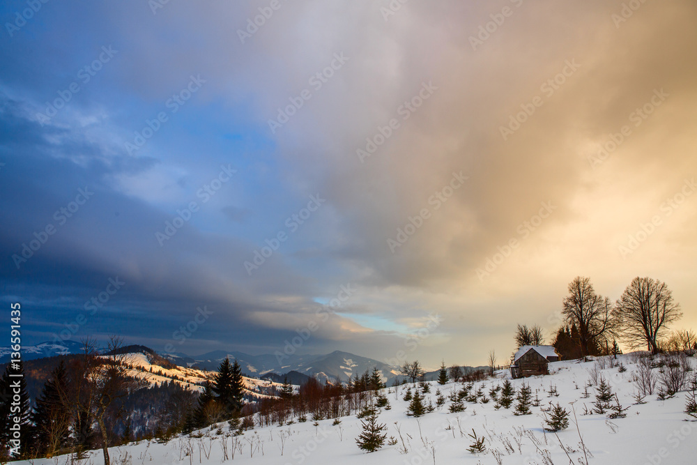 Winter mountain landscape at sunset with dramatic clouds Ukrainian Carpathians Winter mountain landscape at sunset with dramatic clouds Ukrainian Carpathians