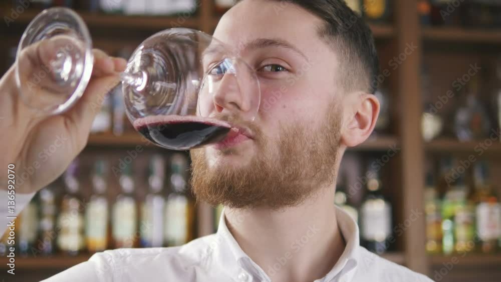 Sommelier tating the wine, slow motion Sommelier tating the wine, slow motion