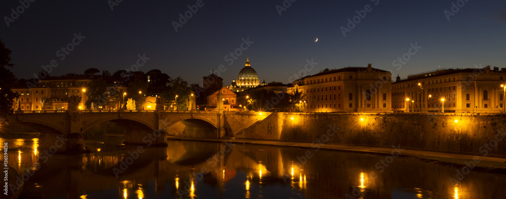 Panoramic view of Rome and Tiber at night with Saint Peters Basi