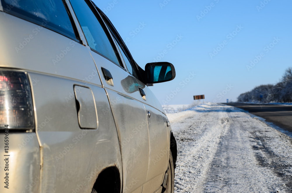 Fototapeta premium Car on a roadside on winter