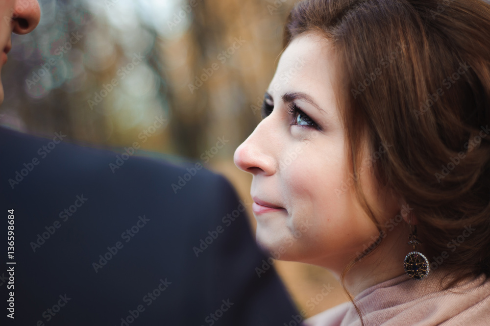 Couple walks in the park. Romantic embrace of newlyweds. Couple walks in the park. Romantic embrace of newlyweds.