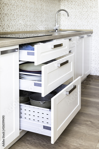 Different height opened drawers for all kind of kitchen stuff for best organization and storage 