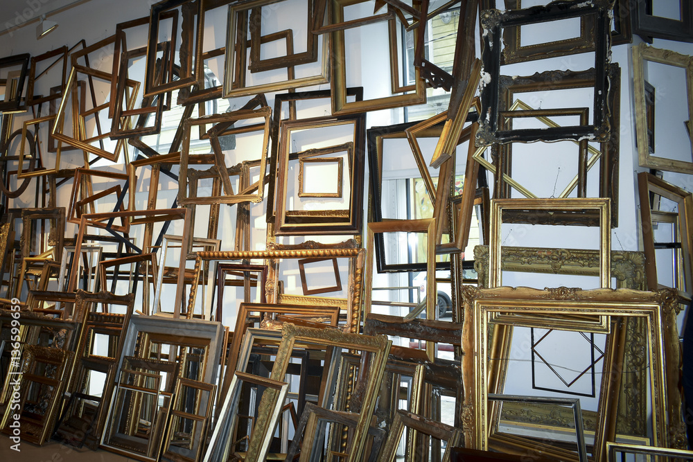 A large amount of empty picture frames in a flat