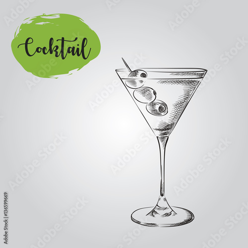 Martini with olive in glass hand drawn sketch isolated on white background. Alcoholic cocktails sketch elements vector illustration.