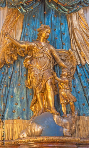 VIENNA, AUSTRIA - DECEMBER 19, 2016: The polychrome carved statue of archangel Raphael in church Mariahilfer Kirche by unknown artist of 18. cent. photo