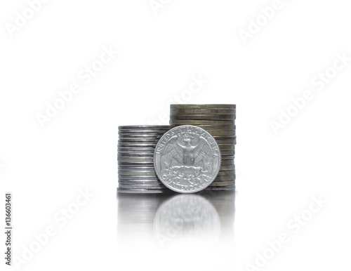Two piles of coins with quarter dollar photo
