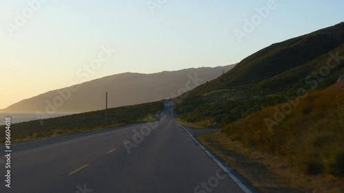 sunset time california road trip ocean bay passenger front panorama 4k usa
