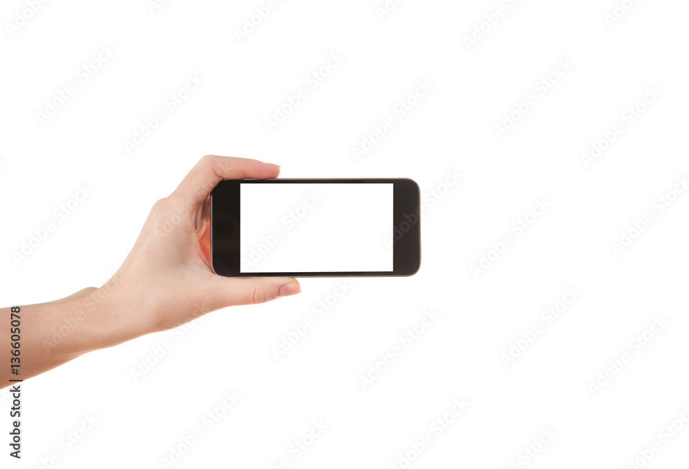 Hand girl holding a mobile phone on a white background