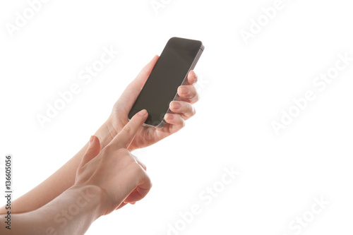 Hand girl holding a mobile phone on a white background 