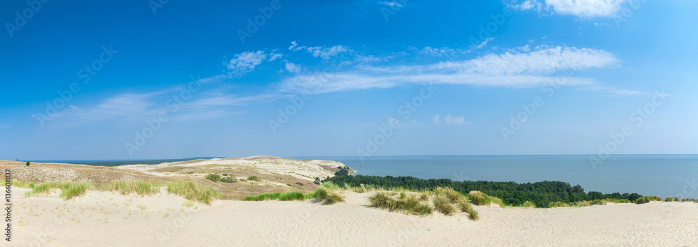 Panoramic view on dunes of the Curonian spit. This place to the highest drifting sand dunes in Europe. Nida, Lithuania. Panoramic view on dunes of the Curonian spit. This place to the highest drifting sand dunes in Europe. Nida, Lithuania.