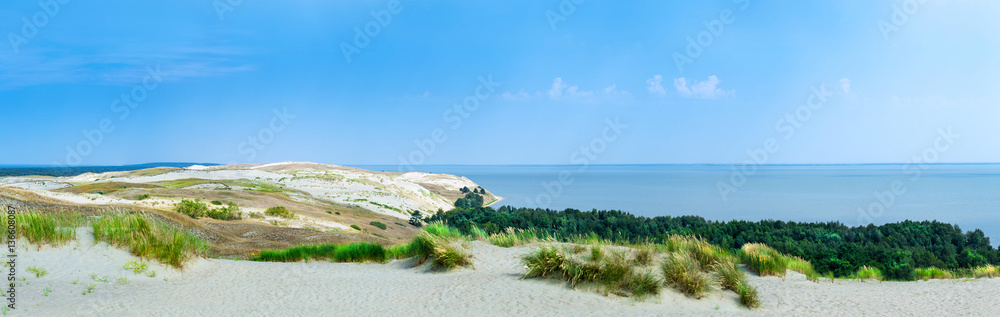 Panoramic view on dunes of the Curonian spit. This place to the highest drifting sand dunes in Europe. Nida, Lithuania. Panoramic view on dunes of the Curonian spit. This place to the highest drifting sand dunes in Europe. Nida, Lithuania.