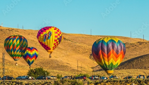 Four Hot Air Balloons Near Parking