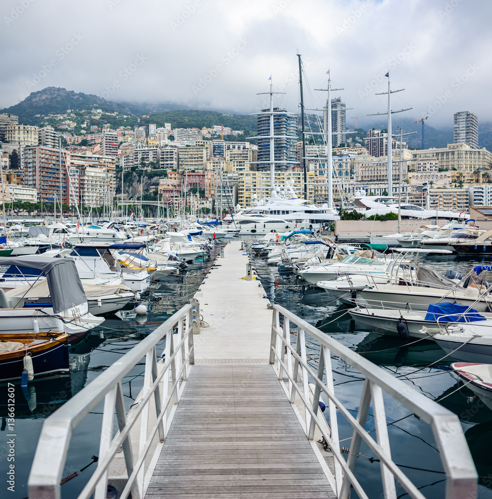 The Principality of Monaco - July, 2016: Monte Carlo harbour city panorama. View of luxury yachts and apartments in harbor of Monaco, Cote d'Azur.