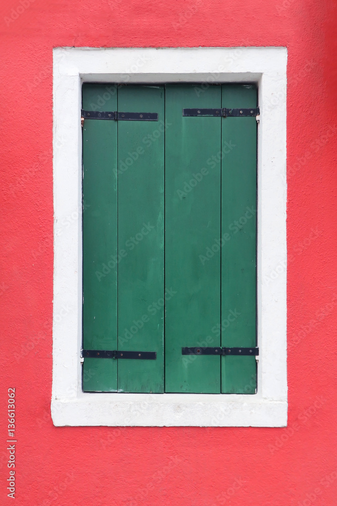 Closed green window shutters