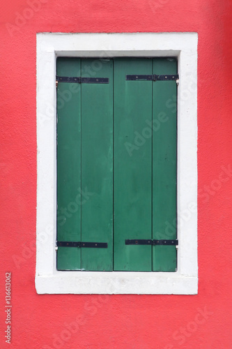 Closed green window shutters