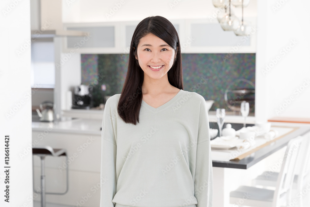 portrait of attractive asian woman in the kitchen portrait of attractive asian woman in the kitchen
