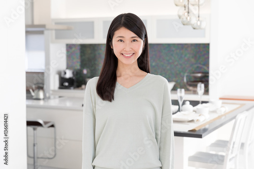 portrait of attractive asian woman in the kitchen