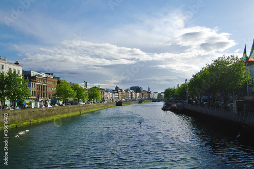 Liffey river crosses Dublin city, cloudy wheather