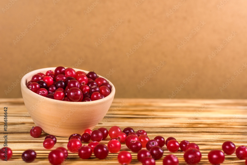 Cranberry. Cranberries on glay Plate Wooden Background Cranberry. Cranberries on glay Plate Wooden Background