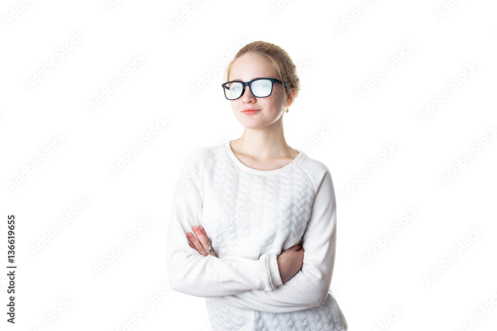 Girl teenager in glasses and a white sweater, crossed her arms and smiles. Isolated on white background Girl teenager in glasses and a white sweater, crossed her arms and smiles. Isolated on white background