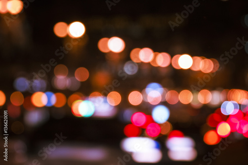 Colorful lights from cars in defocus, night, outdoor © Artem
