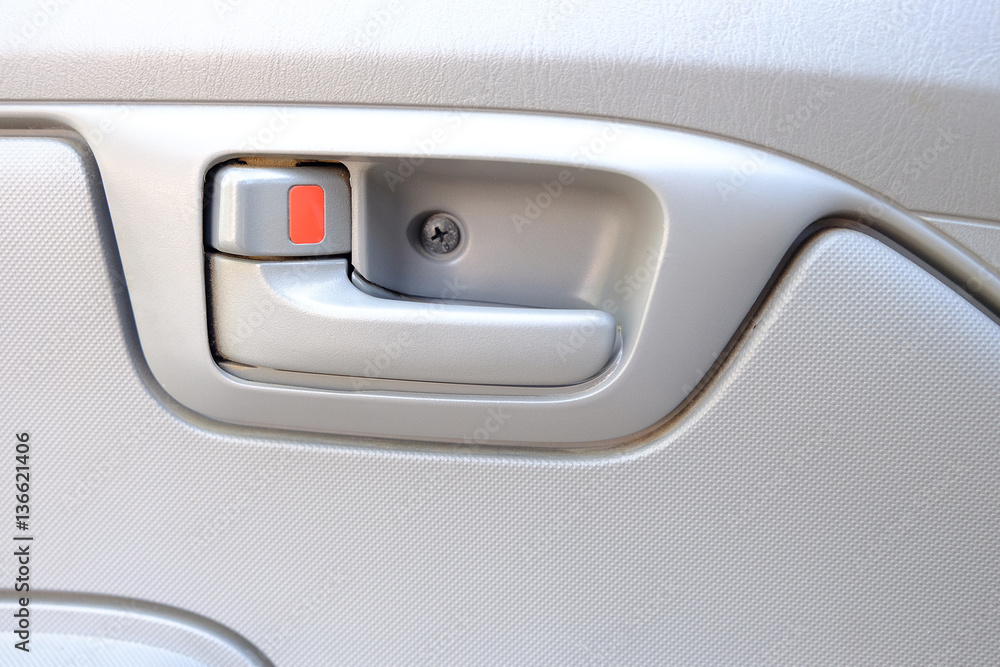 Fototapeta premium inside car door lock beige color close up..